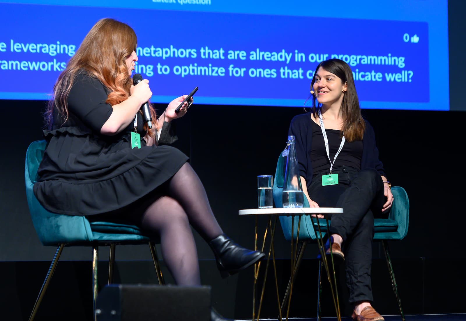 a photo of maggie answering questions after a talk